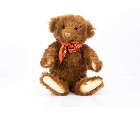 A Steiff limited edition Raffles teddy bear, 608 of 1847, made exclusively Singapore in 1997, wearing printed silk orange Raf