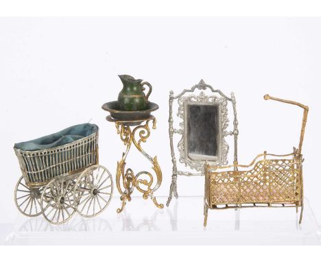 German soft metal dolls’ house items a gold painted wash stand with green cast-metal jug and basin —4 1/4in. (11cm.) high; a 