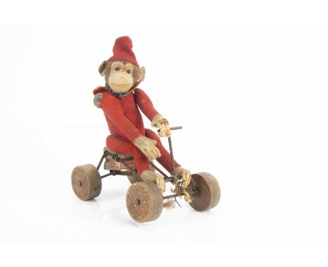 A Steiff red felt Record Peter 1913-20, with brown head, black boot button eyes, cream face, ears, hands and feet, button to 