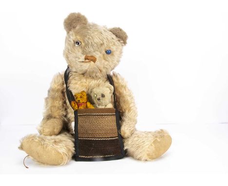 A large post-war Pixie Toys teddy bear,  with pink mohair (faded), clear and black glass eye with remains of painted back, br