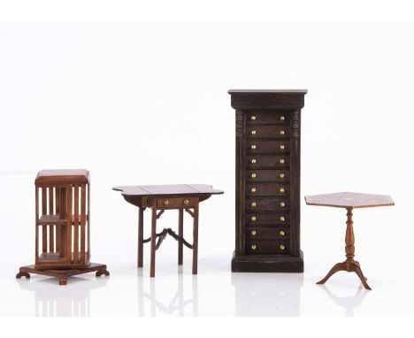 Artist Miniature dolls’ house furniture, a Len White revolving bookcase with parquetry top —3in. (7.5cm.) high; a Mat? Chandl