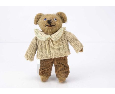 A rare Einco Chiltern Toy Works Master Teddy circa 1915, with blonde mohair head, arms and feet, white, blue and black opaque