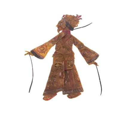 A 1940s Chinese shadow puppet, hand-cut vellum with articulated arms and legs, an Emperor or Mandarin —25 1/4in. (62cm.) high