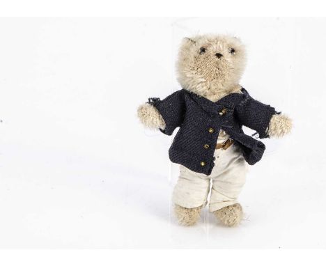 A rare Farnell WWI dressed solider teddy bear, with white mohair, clear and black glass eyes, pipe-cleaner ears, swivel head 