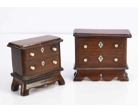 Two 19th century chest of drawer money banks,  both with mother of pearl dummy escutcheons, carved bases, lift off tops to re