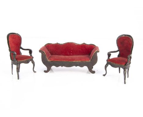A Rock & Graner painted tinplate dolls’ house sofa and two chairs,  painted wood effect brown, the chairs with balloon backs,