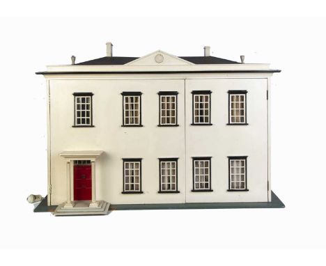 Woolley House,  a mid 20th century dolls’ house, the white painted house with sun crest pediment, nine windows and front porc