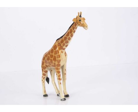 A Forest Toy of Brockenhurst giraffe,  carved and painted wood, light tan with dark tan spots, white socks —9in. (23cm.) high