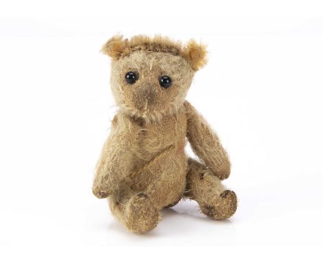 A rare Farnell two faced larger sized soldier teddy bear,  with blonde mohair, black glass eyes, pronounced nose, swivel head