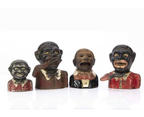 Four cast-metal black men money banks, a cast-iron Jolly N***** Bank with mechanical arm —6 3/4in. (17cm.) high; another simi