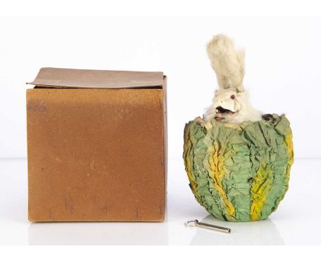 A Roullet & Decamps style clockwork automaton white rabbit in cabbage,  white fur covered with light bulb eyes operated by ba