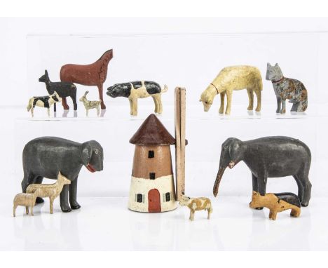 A pair of Ezgebirge painted wooden Noah’s Ark elephants, painted the grey —4in. (10cm.) long (one missing trunk and both miss