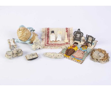 Doll’s accessories,  a cast-metal desk set painted with flowers comprising inkwell, pen tray, blotter and clock —2 1/2in. (6.