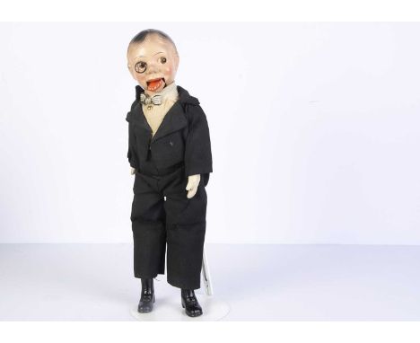 A composition headed toy Charlie McCarthy ventriloquist puppet, with painted side glancing brown eyes, monacle, string operat