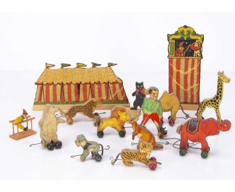 A Chad Valley Circus parade toy train, wooden with applied paper, comprising lion tamer, red elephant and eight other wheeled