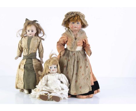 Three dolls, a German bisque shoulder-head doll with sleeping brown eyes, blonde hair wig, impressed 50/3, gusseted kid body 