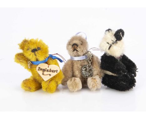 Three post-war miniature Schuco teddy bears,  with golden mohair, black pin eyes, black stitched nose and mouth, swivel head,