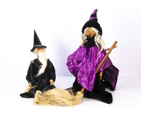 A recent witch and wizard string puppet, a resin headed witch with well painted face, jointed arms with resin hands, bodiless