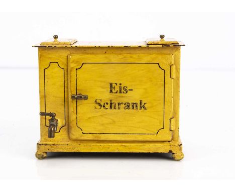 An early 20th century German painted tinplate large scale dolls’ house Eis-Schrank (Ice Box),  painted yellow ochre with blan