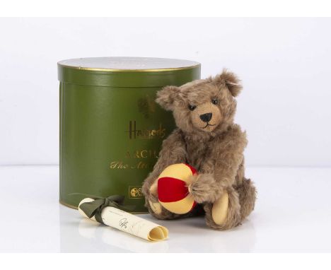 A Steiff limited edition Archie The Attic Teddy Bear for Harrods, 91 of 1500, 2nd in the Attic Bear series, holding a felt ba