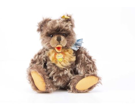 A 1960-64 Steiff Zotty teddy bear, with reddish brown frosted mohair, brown and black glass eyes, swivel head, jointed limbs,