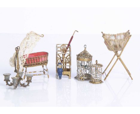 German gold painted  soft metal dolls’ house items a four-lit chandelier  —2 1/2in. (6.5cm.) high, a folding sewing basket, a