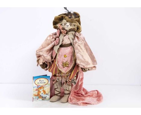 An artist Puss in Boots character cat, with white mohair face, hands and tail, black painted details, light orange and black 