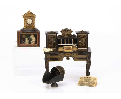 A late 19th century Waltershausen type desk, dark stained with gilt transfer decoration, pigeon holes and two cupboards —5in.