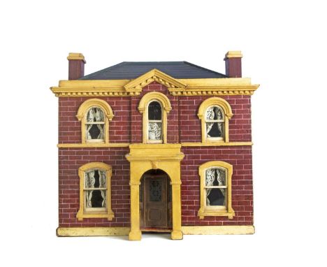 A late 19th century English painted wooden dolls’ house, the exterior painted with red brick and cream stonework, central fro