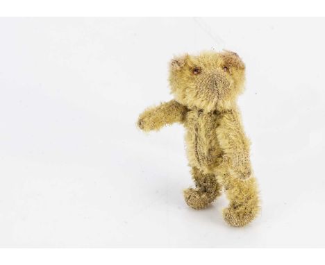 A Farnell WWI solider teddy bear, with blonde mohair, orange and black glass eyes, pipe-cleaner ears, swivel head and pin joi