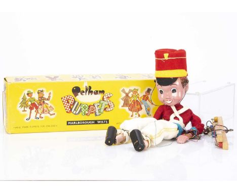 A Pelham Puppet SL Bom an Enid Blyton toy soldier character 1960s, in original clothes and yellow box with end stamp ‘SL Bom’