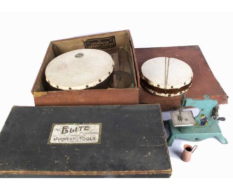 The Crackerjack Portable Jazz Set, comprising two drums and a cymbal, in original oil-cloth covered card box  —15in. (38cm.) 