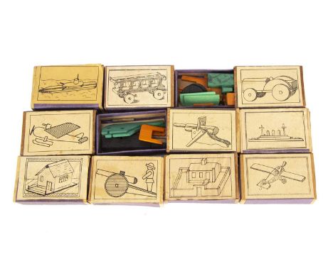 Ten matchbox construction toy sets,  probably German comprising two aeroplanes, two battle ships, two house, tractor, two gun