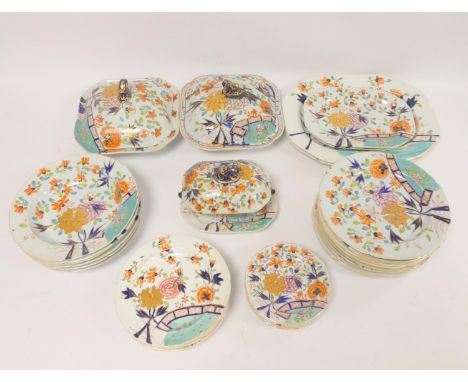 Ironstone part dinner service, circa 1820, decorated with allover foliage in the Imari palette, comprising two tureens with c