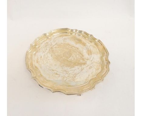 Silver circular waiter with shaped moulded edges on scroll feet, K.O.S.B badge and presentation, by Deakin, Sheffield 1918. 2