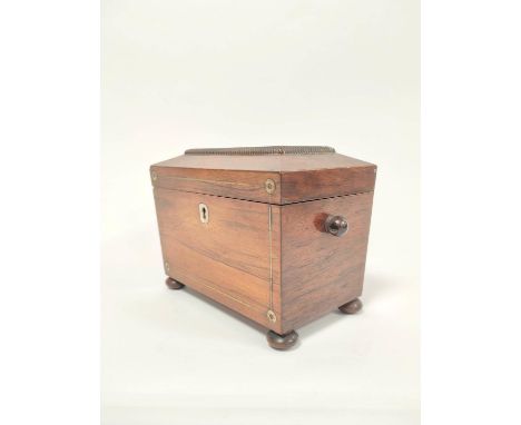 Early 19th century rosewood tea caddy, with mother of pearl inlay and escutcheon, enclosing twin covers, on bun feet, 13.5cm 