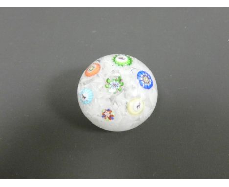 Baccarat, spaced millefiori paperweight set with seven individual canes, including three Gridel silhouettes of a deer, a hors