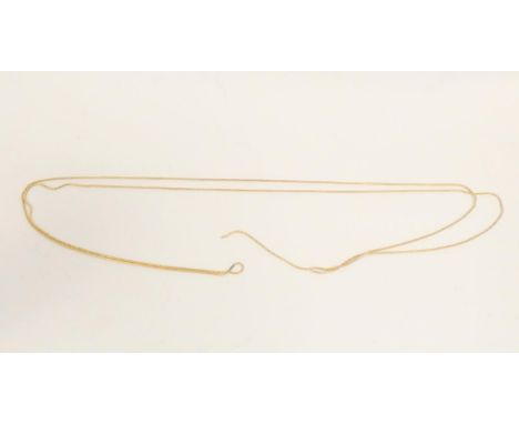 A partial gold muff chain lacking clip. 16.3g Condition report:Acid tests as 14ct gold.Full lenght 155cm/61" 