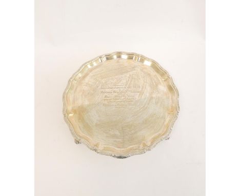 Silver circular waiter with shaped moulded celtic border on scroll feet, by Chatterleys, Birmingham 1964. 25cm, 518g 