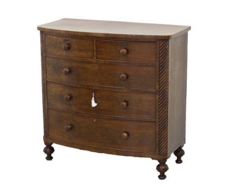 An English mahogany bow front commode, with two short drawers over three long with wood handles, the two front corners with h