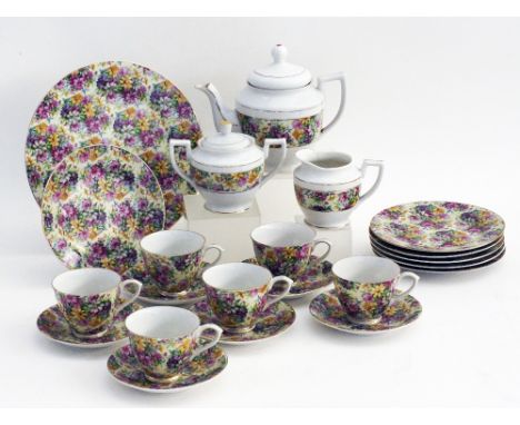 A porcelain tea set with mille fiori transfer print decoration. Comprising of a lidded tea pot H18cm (the lid not the origina