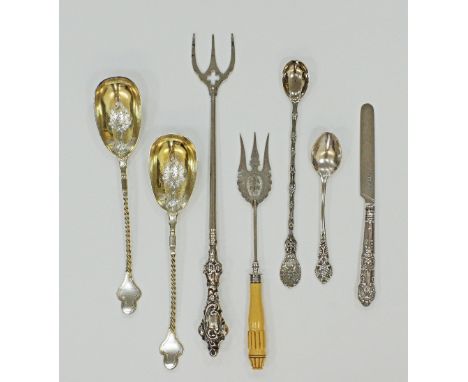 A collection of silver and plated serving flatware including a silver and ivory mounted toasting fork and a pair of sterling 