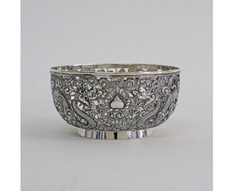A CHINESE EXPORT SILVER BOWL MARK OF WANG HING OF HONG KONG, CIRCA 1910. Pierced and nicely chased and engraved with two drag