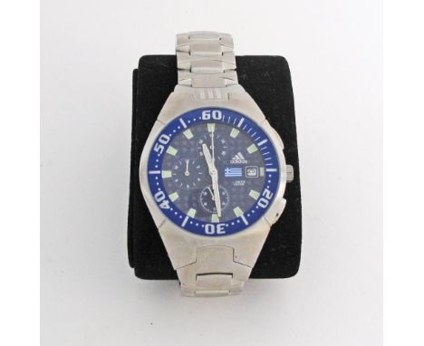 An Adidas chronograph watch on a heavy metal strap. Limited edition commemorating Greece and numbered 004, with an image of t