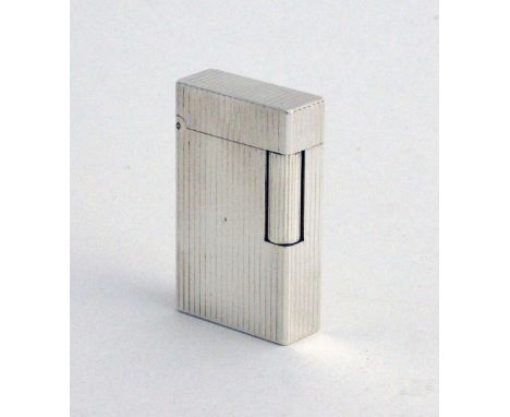 A Dupont silver plated cigarette lighter, with reeded decoration - PARIS, MADE IN FRANCE, REF. 1E4CF59, H58mm.