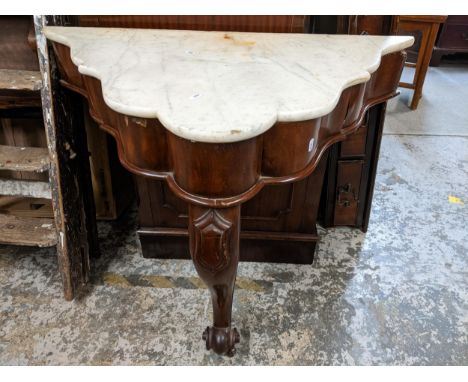 An early 20th century mahogany console table with shaped marble top, carved cabriole front leg Location: 