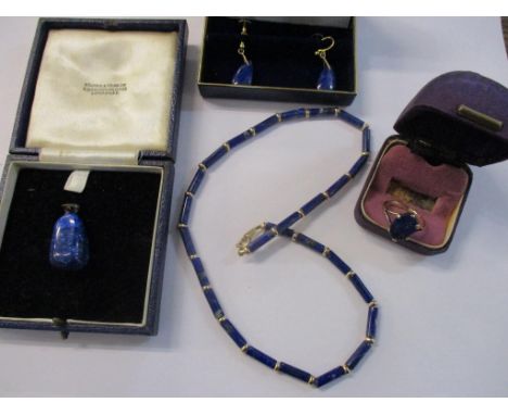 A group of lapis lazuli and gold jewellery to include a lozenge beaded necklace with 9ct gold clasp and yellow metal spacers,