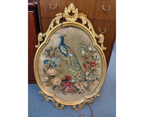 A Victorian wall hanging tapestry of a peacock in a gilt frame with floral motifs, 86cm H x 59cm W 