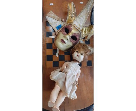 A Venetian style mask with ribbon fastening and a vintage Pedigree doll A/F. Location:RAF 