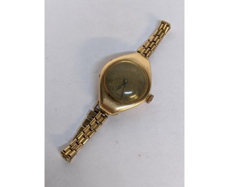 A ladies 14ct gold manual wind wristwatch on a 9ct gold strap, 21.7gLocation: 